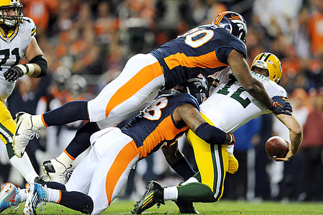 His receivers unable to get open, Aaron Rodgers had little time to improvise against the Broncos’ top-notch pass rush.